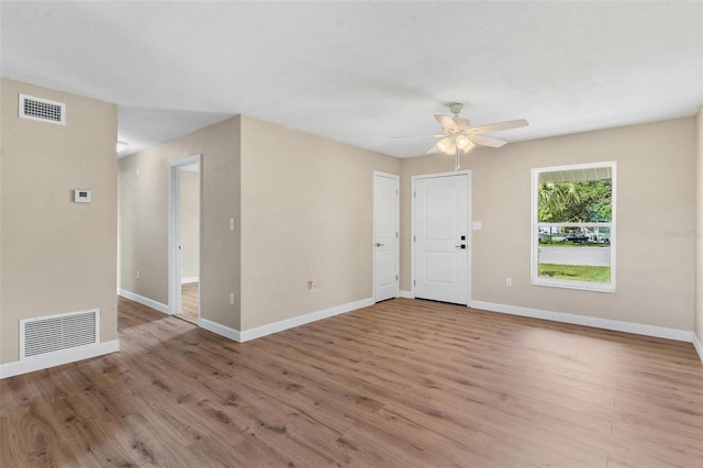 4 Kristin Ln, Eustis, FL 32726 - empty room featuring wood finished floors, a ceiling fan, and baseboards