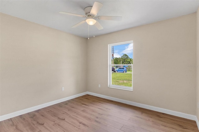 4 Kristin Ln, Eustis, FL 32726 - empty room featuring light wood-type flooring, baseboards, and a ceiling fan