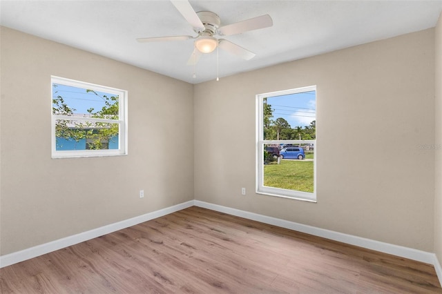 4 Kristin Ln, Eustis, FL 32726 - unfurnished room featuring baseboards, light wood finished floors, and a ceiling fan