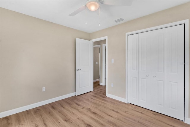 4 Kristin Ln, Eustis, FL 32726 - unfurnished bedroom with baseboards, light wood-type flooring, a closet, and ceiling fan