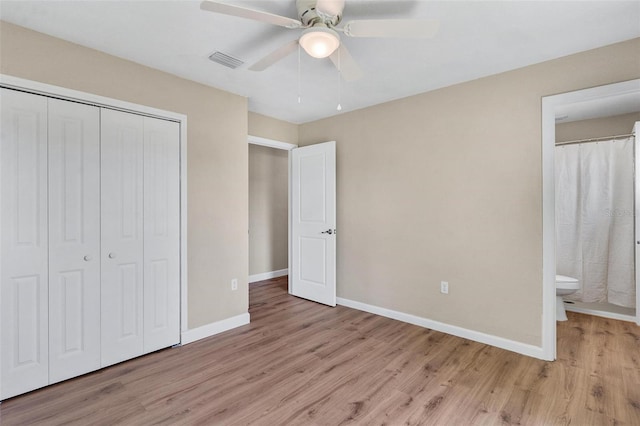 4 Kristin Ln, Eustis, FL 32726 - unfurnished bedroom with light wood finished floors, a closet, baseboards, and ensuite bathroom