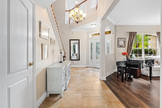 5144 Rishley Run Way, Mount Dora, FL 32757 - entryway with baseboards, ornamental molding, stone tile floors, and a chandelier