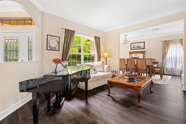 5144 Rishley Run Way, Mount Dora, FL 32757 - living room featuring dark wood finished floors, crown molding, arched walkways, and baseboards