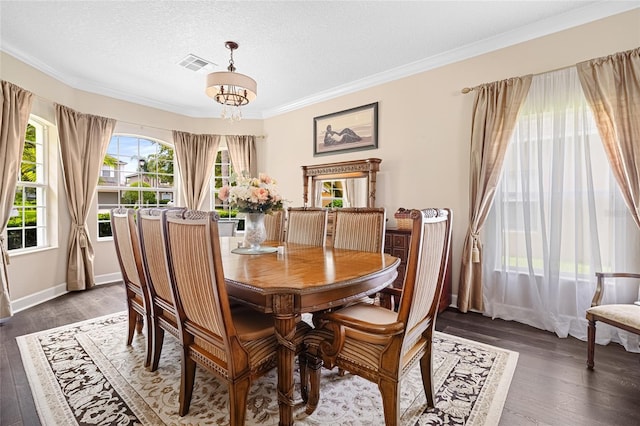 5144 Rishley Run Way, Mount Dora, FL 32757 - dining space featuring wood finished floors, crown molding, a chandelier, and a textured ceiling