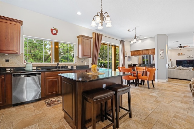 5144 Rishley Run Way, Mount Dora, FL 32757 - kitchen with stainless steel dishwasher, a sink, tasteful backsplash, a chandelier, and recessed lighting