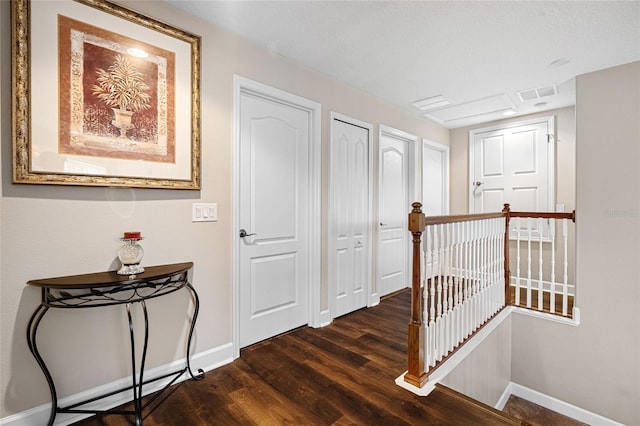 5144 Rishley Run Way, Mount Dora, FL 32757 - hall featuring an upstairs landing, baseboards, dark wood-style floors, and attic access