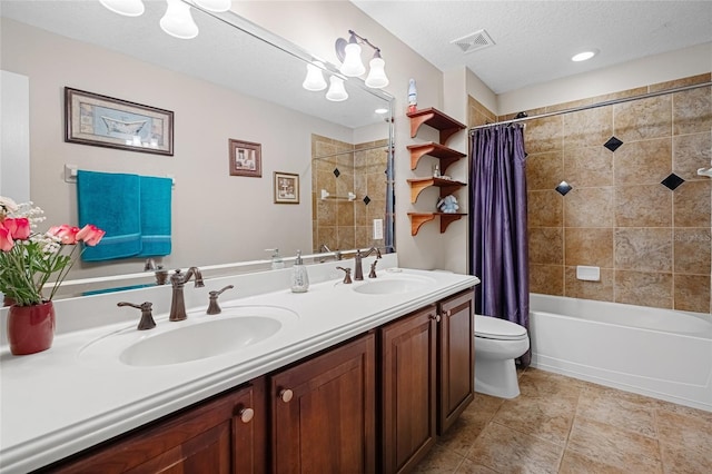 5144 Rishley Run Way, Mount Dora, FL 32757 - full bathroom featuring toilet, double vanity, shower / bath combo, tile patterned flooring, and a textured ceiling