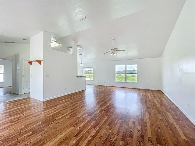 439 Gentle Breeze Dr, Minneola, FL 34715 - unfurnished living room featuring wood finished floors, a ceiling fan, and baseboards