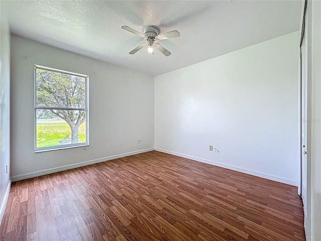 439 Gentle Breeze Dr, Minneola, FL 34715 - unfurnished room with wood finished floors, ceiling fan, and baseboards