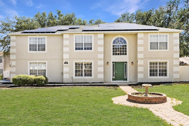 800 Daybreak Dr, Fruitland Park, FL 34731 - view of front of property featuring a front lawn, solar panels, and stucco siding