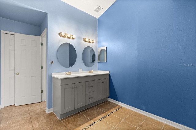 800 Daybreak Dr, Fruitland Park, FL 34731 - bathroom with double vanity and tile patterned floors