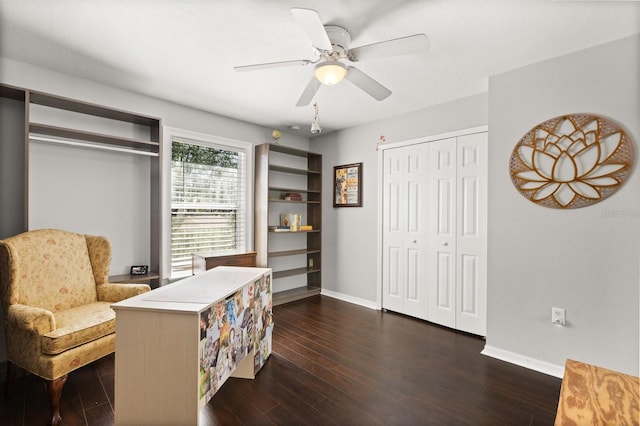800 Daybreak Dr, Fruitland Park, FL 34731 - sitting room featuring a ceiling fan and dark wood-type flooring