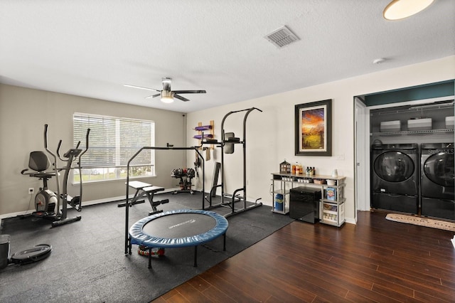 800 Daybreak Dr, Fruitland Park, FL 34731 - workout area featuring washer and dryer, a ceiling fan, wood finished floors, and a textured ceiling