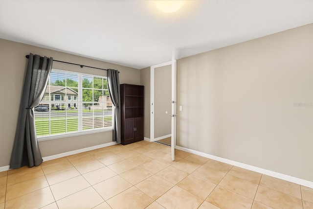 800 Daybreak Dr, Fruitland Park, FL 34731 - empty room with baseboards and light tile patterned floors