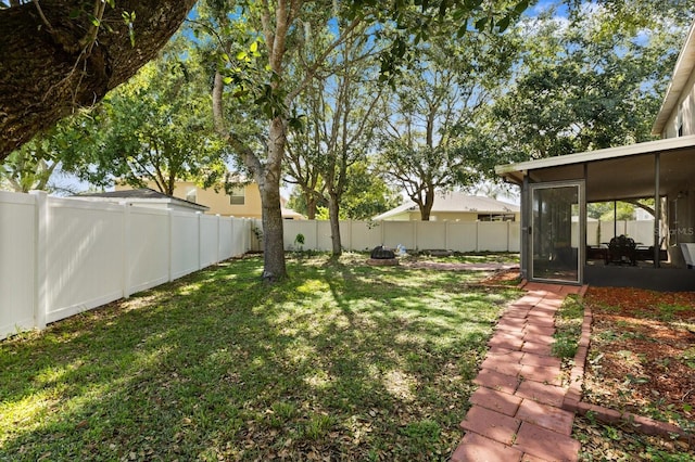800 Daybreak Dr, Fruitland Park, FL 34731 - fenced backyard with a sunroom