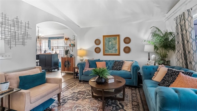 1130 Woodsong Way, Clermont, FL 34714 - living room featuring arched walkways and lofted ceiling