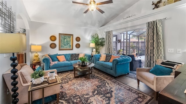 1130 Woodsong Way, Clermont, FL 34714 - living area with vaulted ceiling, ceiling fan, arched walkways, and wood finished floors