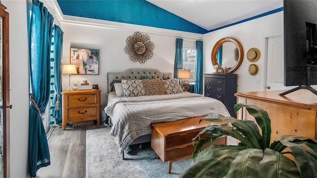 1130 Woodsong Way, Clermont, FL 34714 - bedroom with vaulted ceiling and wood finished floors