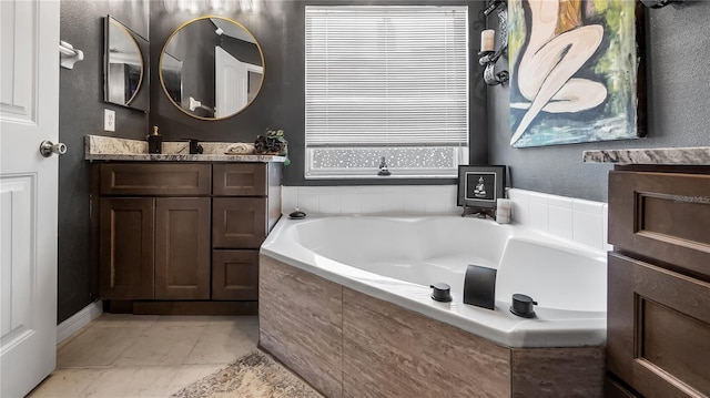 1130 Woodsong Way, Clermont, FL 34714 - bathroom featuring vanity and a garden tub
