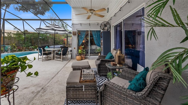1130 Woodsong Way, Clermont, FL 34714 - view of patio with ceiling fan, an outdoor hangout area, outdoor dining space, a lanai, and an outdoor pool
