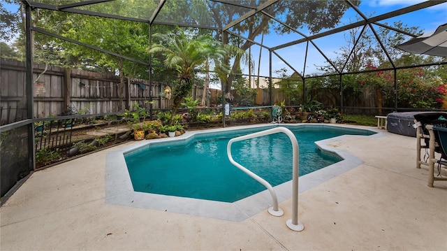 1130 Woodsong Way, Clermont, FL 34714 - view of pool featuring a fenced backyard, a patio area, area for grilling, and a lanai