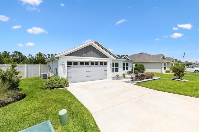 4157 Tiedemann Loop, The Villages, FL 32163 - ranch-style home with board and batten siding, central AC, an attached garage, and concrete driveway