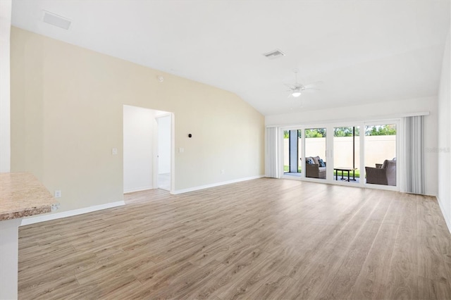4157 Tiedemann Loop, The Villages, FL 32163 - unfurnished living room featuring lofted ceiling, ceiling fan, light wood-style flooring, and baseboards