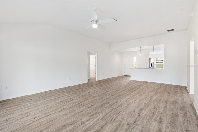 4157 Tiedemann Loop, The Villages, FL 32163 - unfurnished living room featuring a ceiling fan, light wood finished floors, and lofted ceiling