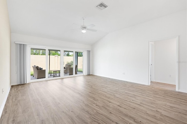 4157 Tiedemann Loop, The Villages, FL 32163 - unfurnished living room featuring a ceiling fan, lofted ceiling, light wood finished floors, and baseboards