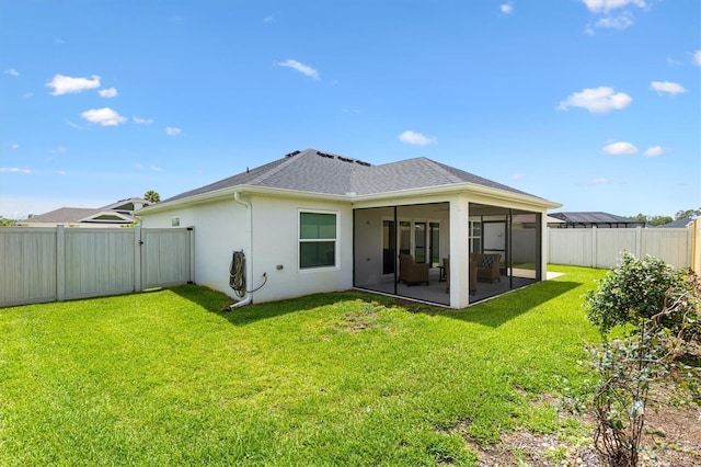 4157 Tiedemann Loop, The Villages, FL 32163 - back of house with a sunroom, stucco siding, roof with shingles, and a gate