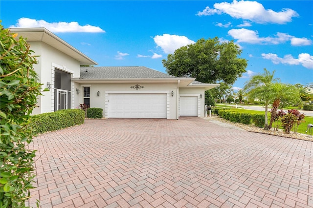 39145 Treeline Dr, Lady Lake, FL 32159 - garage featuring decorative driveway