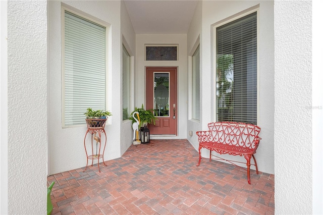 39145 Treeline Dr, Lady Lake, FL 32159 - doorway to property with stucco siding