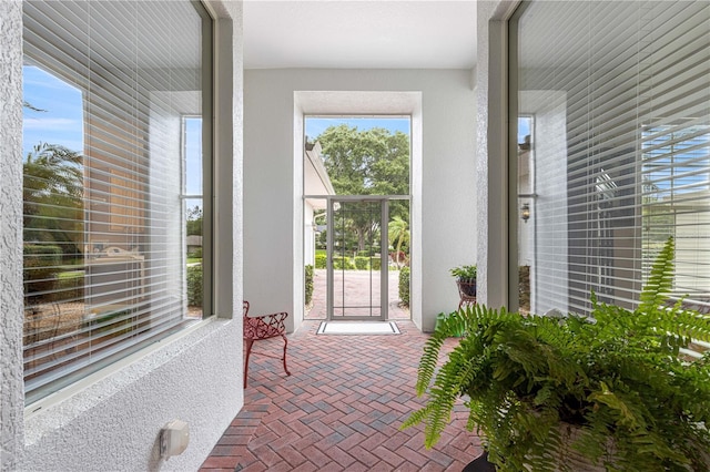 39145 Treeline Dr, Lady Lake, FL 32159 - doorway to property with stucco siding