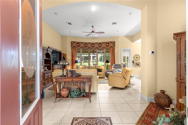 39145 Treeline Dr, Lady Lake, FL 32159 - living area featuring arched walkways, ceiling fan, light tile patterned floors, baseboards, and recessed lighting