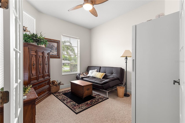 39145 Treeline Dr, Lady Lake, FL 32159 - living area with carpet floors, ceiling fan, and baseboards