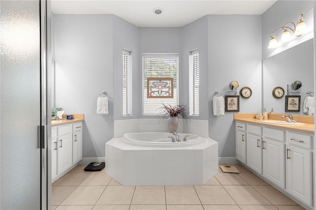 39145 Treeline Dr, Lady Lake, FL 32159 - bathroom featuring vanity, tile patterned flooring, a bath, and baseboards