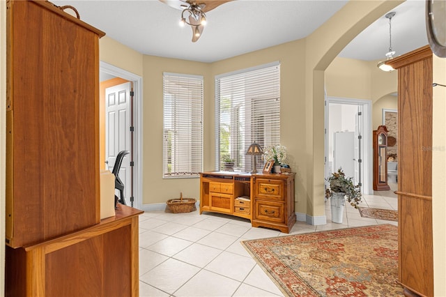 39145 Treeline Dr, Lady Lake, FL 32159 - entryway featuring arched walkways, light tile patterned floors, baseboards, and ceiling fan