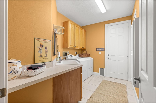 39145 Treeline Dr, Lady Lake, FL 32159 - washroom featuring cabinet space, separate washer and dryer, light tile patterned floors, and baseboards