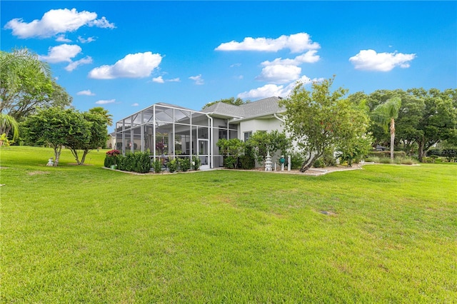 39145 Treeline Dr, Lady Lake, FL 32159 - rear view of property with a lawn and a lanai