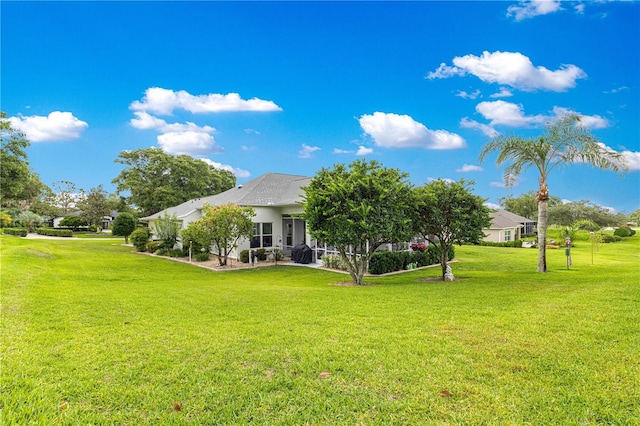 39145 Treeline Dr, Lady Lake, FL 32159 - rear view of property with a lawn
