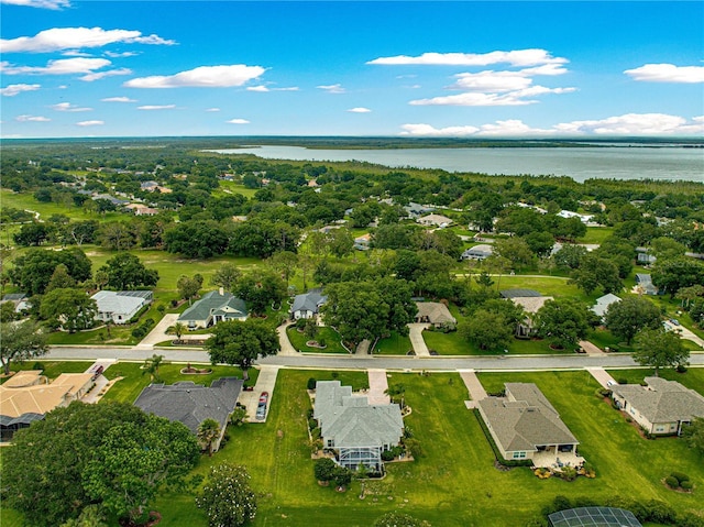 39145 Treeline Dr, Lady Lake, FL 32159 - aerial overview of property's location featuring a large body of water and nearby suburban area