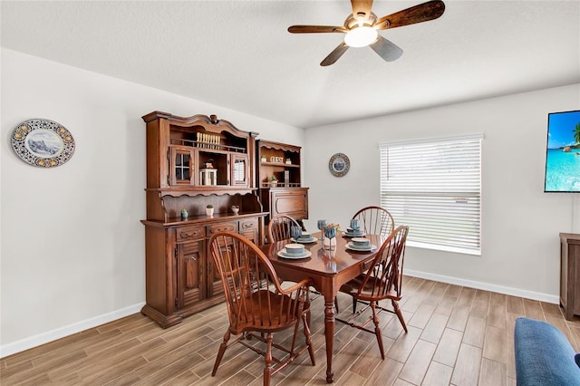 733 Citrus Reserve Blvd, Davenport, FL 33837 - dining space featuring wood tiled floors, a ceiling fan, and baseboards