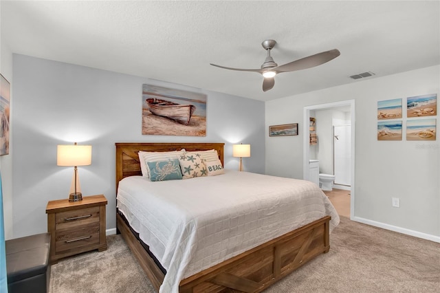 733 Citrus Reserve Blvd, Davenport, FL 33837 - bedroom with light carpet, connected bathroom, baseboards, and ceiling fan