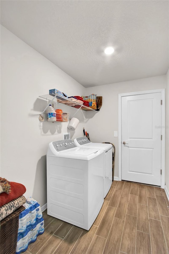 733 Citrus Reserve Blvd, Davenport, FL 33837 - laundry room with washer and dryer, wood finished floors, and baseboards