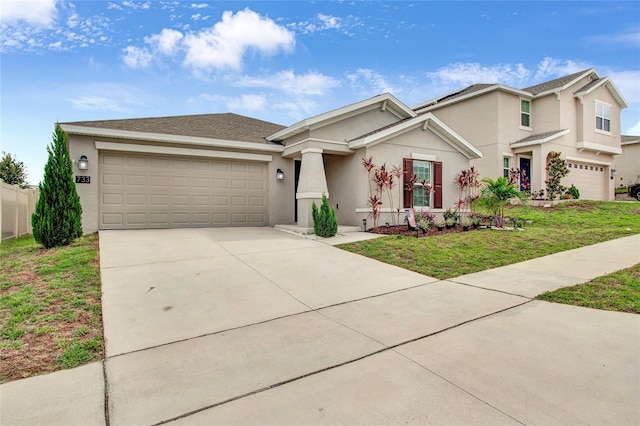 733 Citrus Reserve Blvd, Davenport, FL 33837 - view of front of home with stucco siding, a garage, driveway, and a front yard