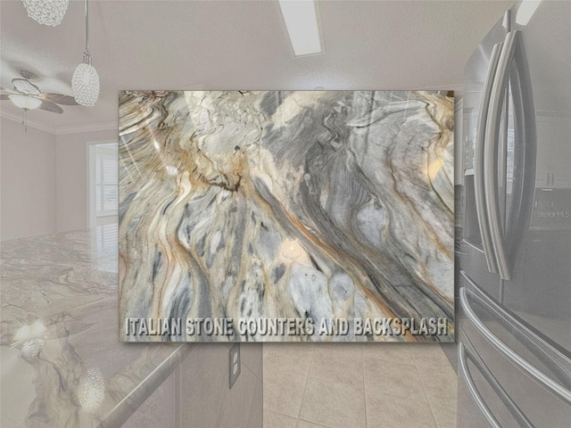 3237 Atwell Ave, The Villages, FL 32162 - detailed view of stainless steel fridge, ceiling fan, and ornamental molding