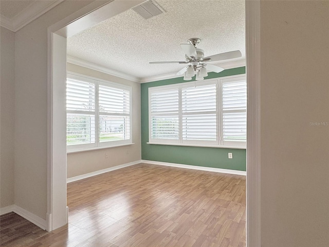 3237 Atwell Ave, The Villages, FL 32162 - empty room featuring ornamental molding, a textured ceiling, wood finished floors, ceiling fan, and baseboards