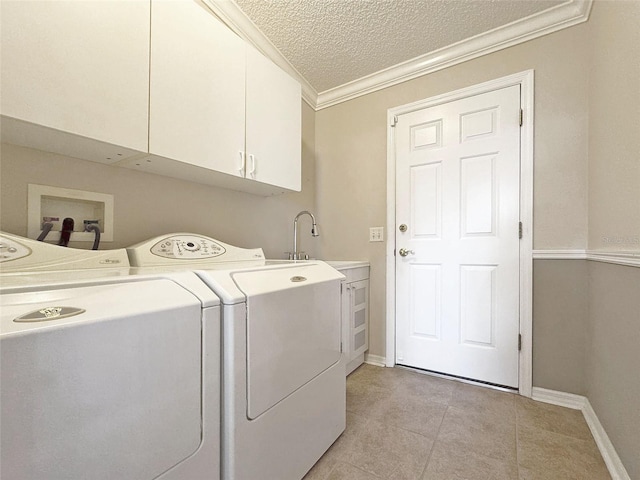 3237 Atwell Ave, The Villages, FL 32162 - laundry area with cabinet space, washer and dryer, a textured ceiling, light tile patterned floors, and baseboards