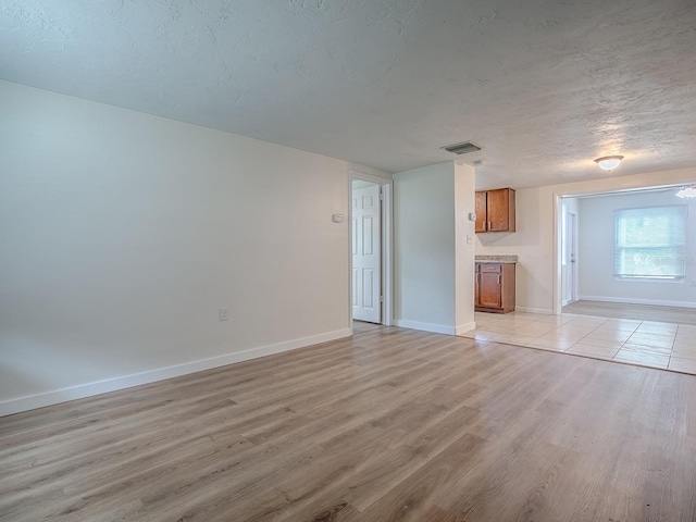 59 S Columbus St, Beverly Hills, FL 34465 - unfurnished living room with light wood-type flooring and baseboards