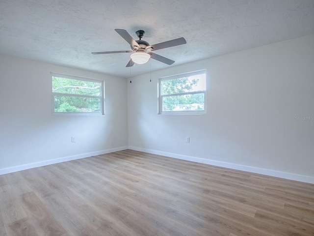 59 S Columbus St, Beverly Hills, FL 34465 - empty room featuring light wood finished floors, plenty of natural light, and baseboards